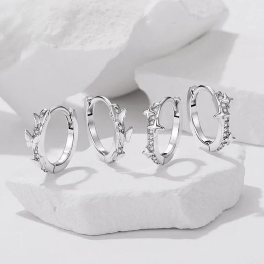 Set of star and butterfly hoop earrings with silver-tone clear rhinestone details