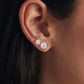 Square moissanite stud earrings in sterling silver, worn on ear