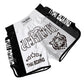 Muay Thai boxing shorts, white and black with “Thai Boxing” emblem and text