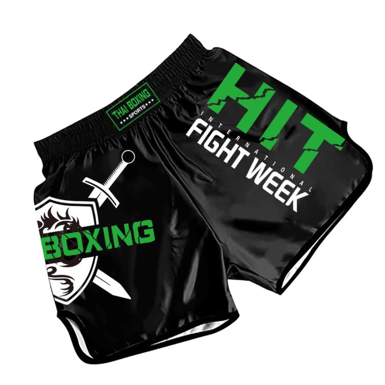 Black muay thai boxing shorts with green Fight Week print and Boxing graphic