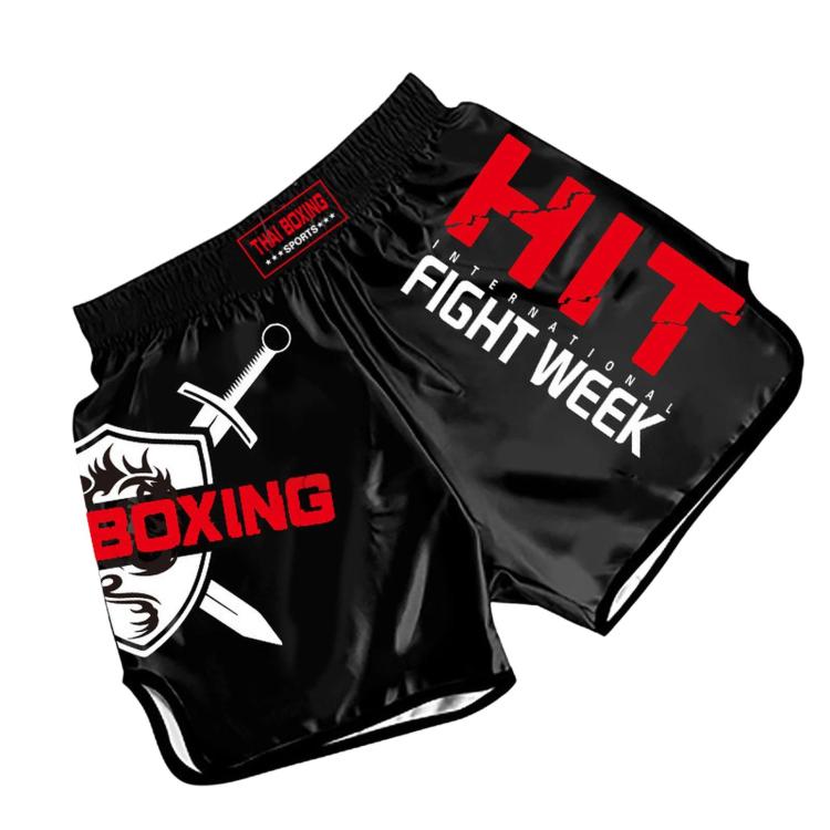 Muay Thai boxing shorts in black with red “FIGHT WEEK” print and boxing graphics.