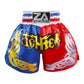 Muay Thai boxing shorts in blue and red with yellow flame graphics and waist logo patch