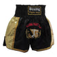 Muay Thai boxing shorts in black with gold satin panels and Boxing Fight Club label