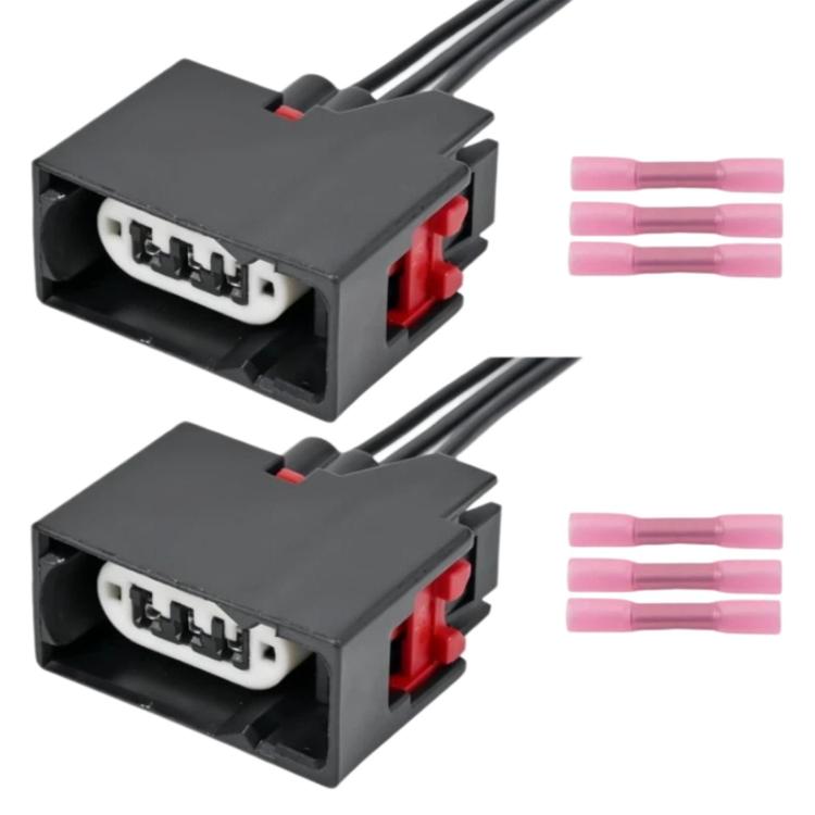 Pair of front turn signal wiring harness connectors with red terminals and pin sockets