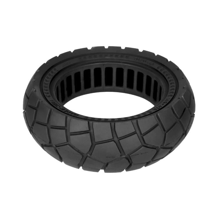 Black solid scooter tire with thick blocks and deep tread, top view