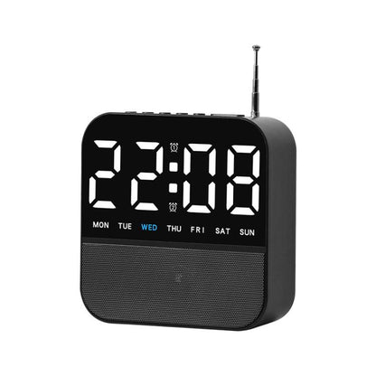 Black digital LED alarm clock radio with white time display and day-of-week lights