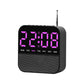 Black digital LED alarm clock radio with pink/purple time display and day-of-week lights