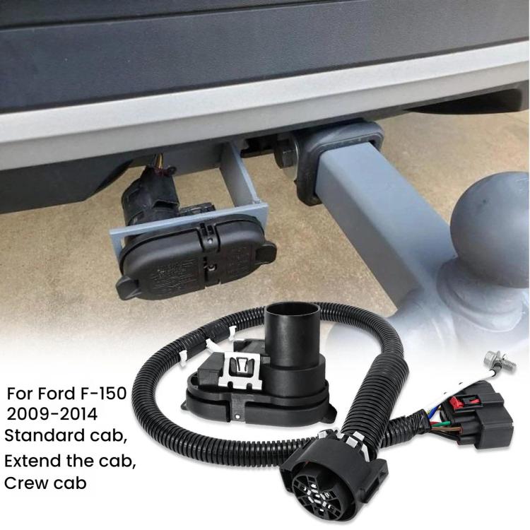 Trailer wiring harness installed under vehicle bumper with coiled cable and 7-pin socket