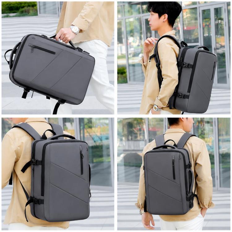 Gray expandable travel laptop backpack worn on back with top handle and shoulder straps