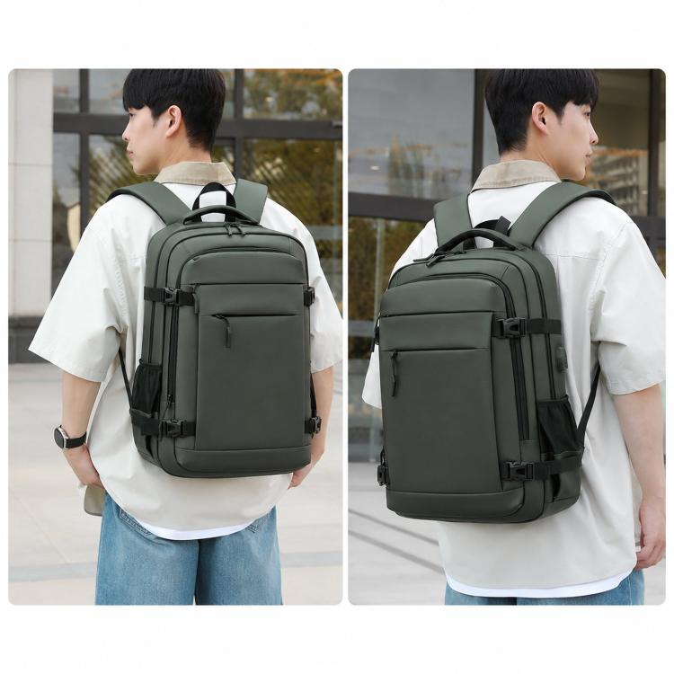 Black laptop backpack worn by person with cushioned shoulder straps