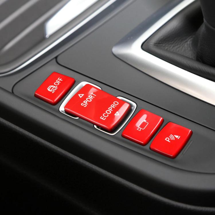 Car gear shift switch buttons set with red caps and white icons on center console