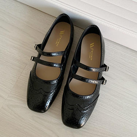 Women's vintage black flat ballet shoes with two buckled straps and brogue detailing