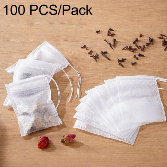 White non-woven tea filter bags, drawstring style, with loose herbs inside