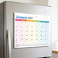 Magnetic fridge calendar pad on refrigerator door, January 2027 monthly view.
