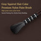 Watercolor paint brush with dense bristles on a dark handle