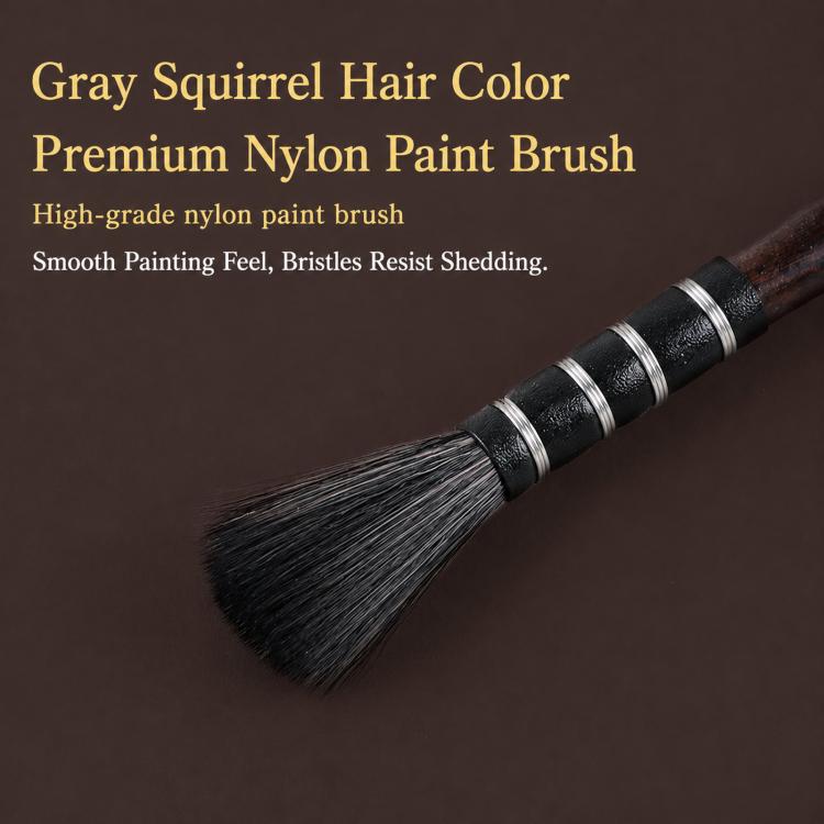 Watercolor paint brush with dense bristles on a dark handle
