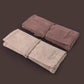 Folded brush roll cases in light and dark fabric for watercolor brushes