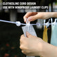 Hand clips a small towel onto an elastic clothesline rope