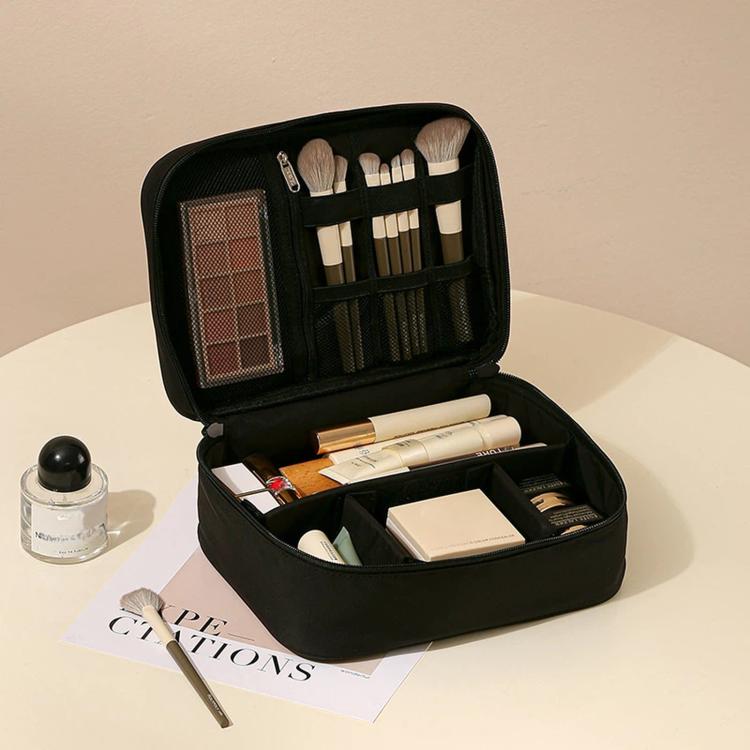 Black makeup bag organizer with zip-top, mesh divider pocket, and brush holder slots