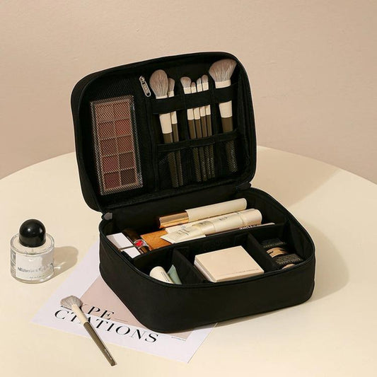Black single-layer makeup organizer bag with adjustable dividers and brush holder slots
