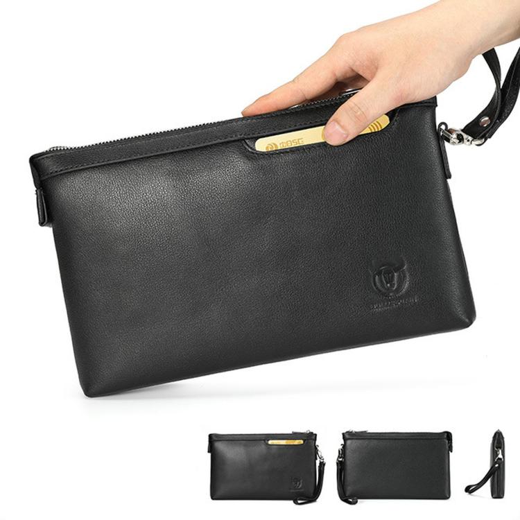Black leather wristlet clutch bag with front emblem, wrist strap, and zip closure.