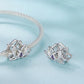 Lotus beaded bracelet with silver-toned bead cord and purple oval lotus gem