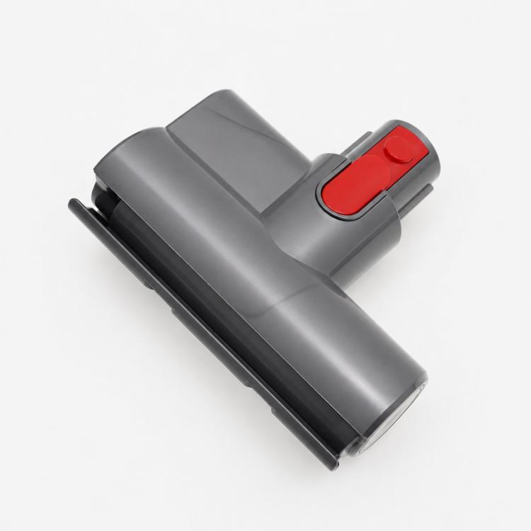 Motorized mattress tool attachment, dark gray body with red power tab