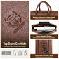 Brown leather grain close-up with embossed logo and reinforced handle stitching