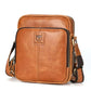Men's tan leather crossbody bag with zip top and front logo patch.