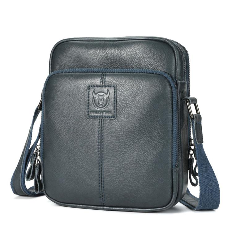 Men's dark blue leather crossbody bag with zip top and front logo patch.