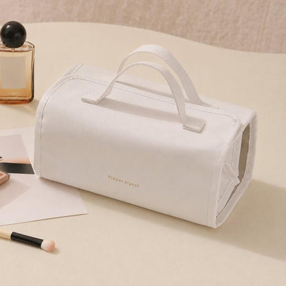White roll-up makeup organizer bag with carry handles and detachable clear compartments