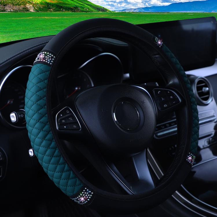 Quilted leather steering wheel cover with rhinestone trim, teal/green