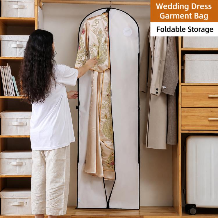 White wedding dress garment bag covering a hanging dress, black trim border