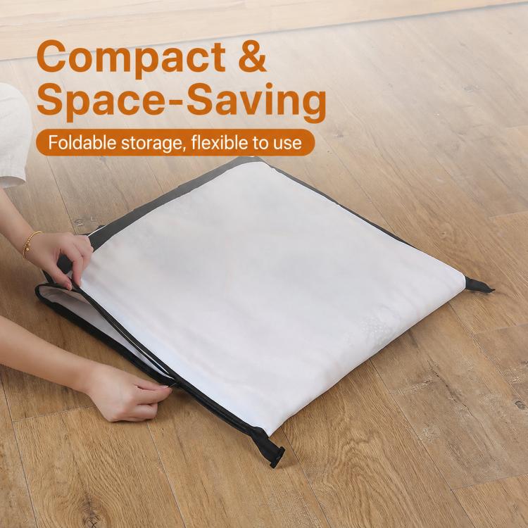 Folded white garment cover with black edge trim and storage strap