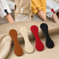 Set of four leather-style magnetic hem clips in tan, ivory, red, and black