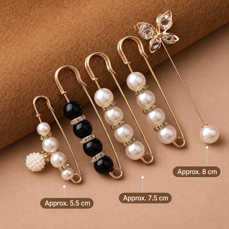 Set of pearl safety pin waist tightener clips in black and white, approx 5.5–7.5 cm