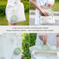 Collapsible silicone cup attached by lanyard to a bag for portable carrying