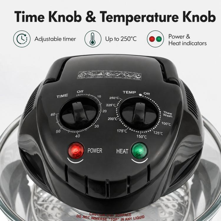 Black air fryer control panel with time and temperature knobs over clear glass bowl