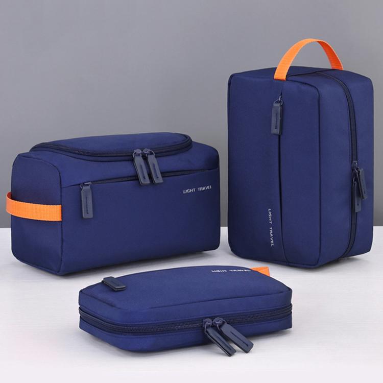 Navy blue mens toiletry bag set with orange accents: two pouches and a small flat case