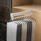 White extendable top-mount hanger rail with row of S-shaped hooks holding scarves