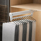 Extendable top-mount closet hanger rail, white bar with black hooks and hanging pants/scarves