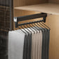 Extendable top-mount closet hanger rail, black bar with black hooks holding pants/scarves