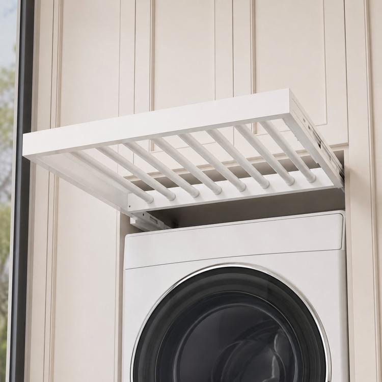 White drying rack with rod slots mounted on a washer with round door