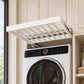 White extendable drying rack with evenly spaced rods on top of a washer