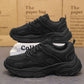 Men's black lace-up running sneakers with textured panels and thick anti-slip outsole