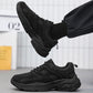 Men's black lace-up sneakers with cushioned collar and rugged tread sole