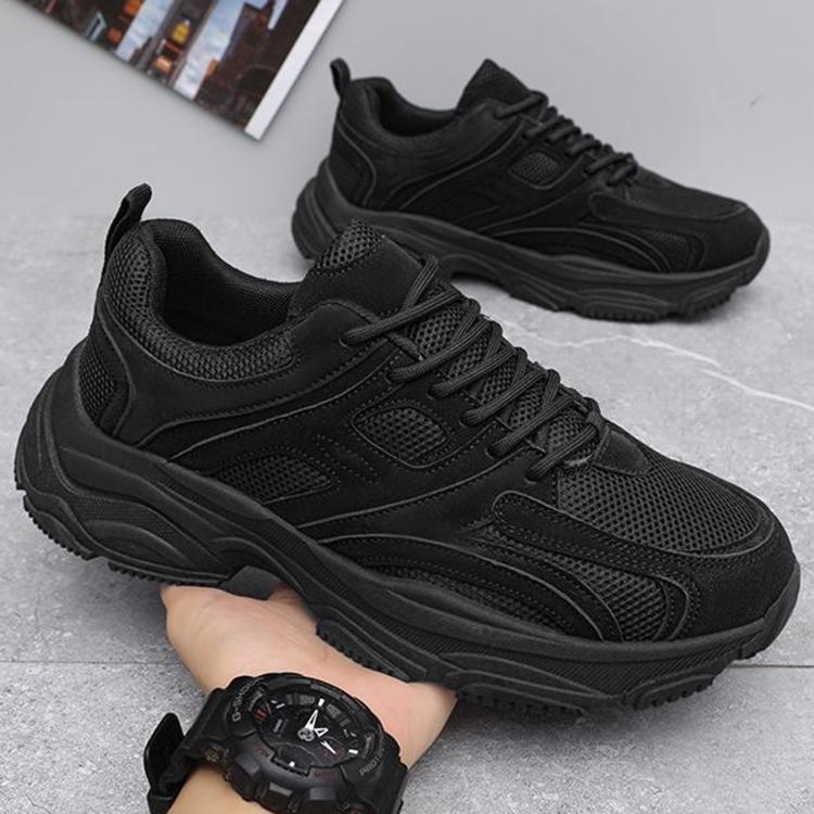 Men's black lace-up sneakers with breathable mesh texture and chunky outsole
