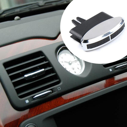 Air vent adjustment clip/paddle with black plastic base and chrome oval top.