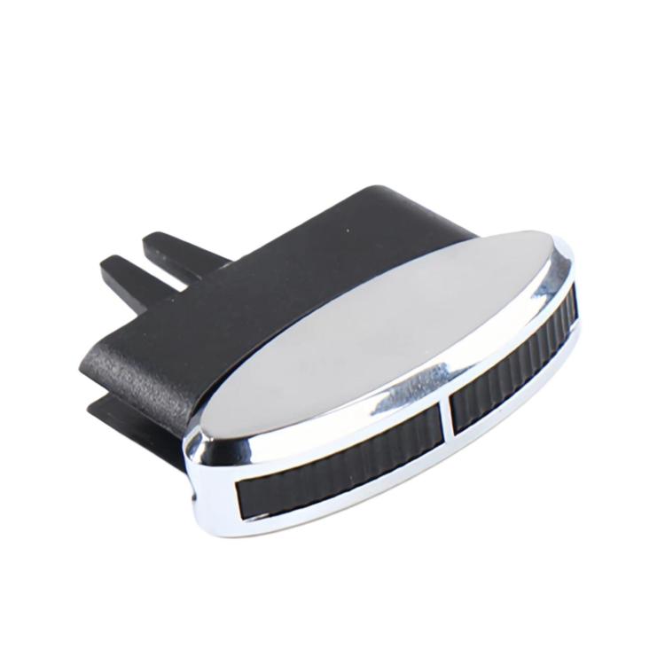 Air vent adjustment clip/paddle with black mounting prongs and chrome oval face.