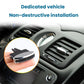 Air vent adjustment clip installed on dashboard vent, black prongs and chrome oval.